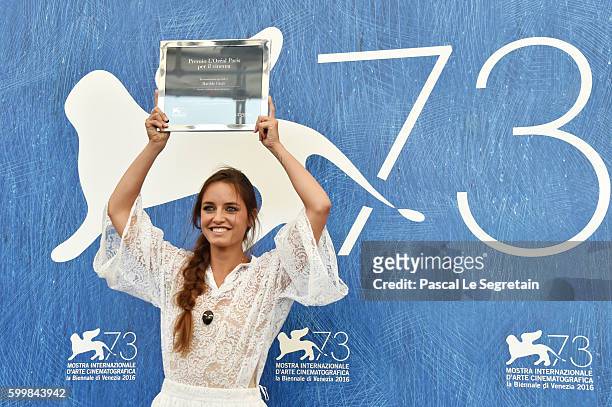 Italian actress Matilde Gioli poses with her 'L'Oreal Paris for Cinema Award' at a photocall during the 73rd Venice Film Festival at Palazzo del...