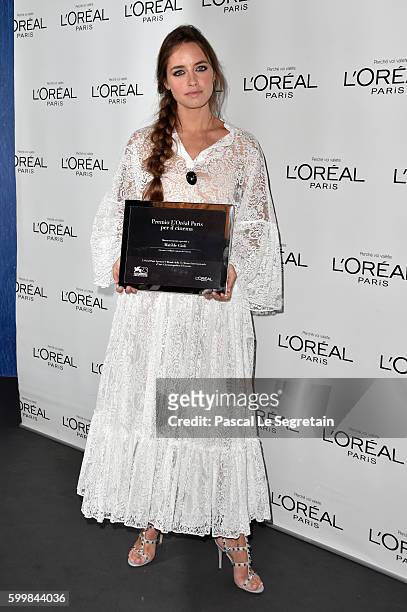 Italian actress Matilde Gioli poses with her 'L'Oreal Paris for Cinema Award' at a photocall during the 73rd Venice Film Festival at Palazzo del...