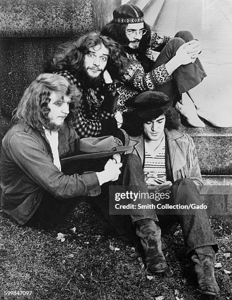 Jethro Tull, band members posing for a group photo, some wearing hippie attire, 1945.