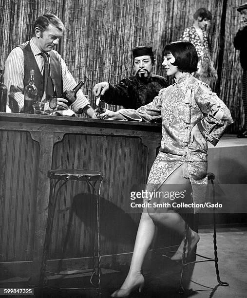 Julie Andrews order a drink at a bar, playing the character of Gertrude Lawrence, in a movie still, 1968.