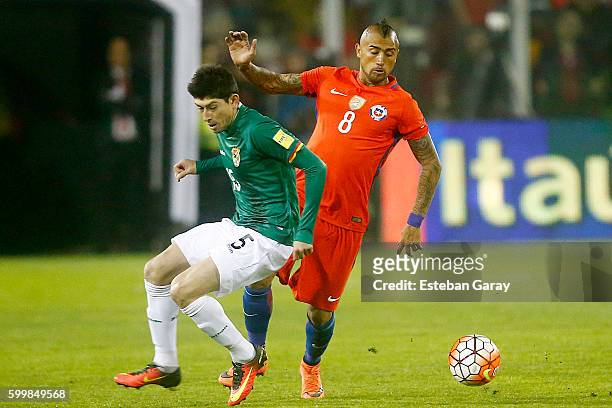 Arturo Vidal of Chile fights for the ball with Nelson Cabrera of Bolivia during a match between Chile and Bolivia as part of FIFA 2018 World Cup...