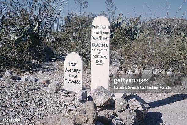 Grave markers for Tom McLaury, Billy Clanton, Tom McLaury, and others, Tombstone, Arizona, 1966.