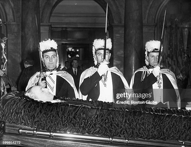 From left, William Hartigan, Nicholas Catizone and Edward McLeavey stand guard over James Michael Curley's casket in Boston on Nov. 14, 1958. Curley...