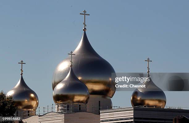 Domes of the Russian Orthodox Cathedral, Sainte-Trinite at the Russian Orthodox Spiritual and Cultural Centre are seen in front of the Eiffel tower...