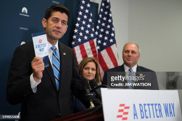 Speaker of the House Paul Ryan, R-WI, holds up "A Better Way" pamphlet as he speaks during a press conference following a closed door meeting of GOP...
