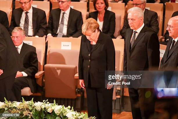 Angela Merkel and Stanislaw Tillich attend the memorial service of late former German President Walter Schee at the Philharmonic on September 7, 2016...