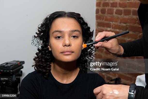 Model prepares backstage at the Rachel Comey fashion show during New York Fashion Week September 2016 on September 7, 2016 in New York City.