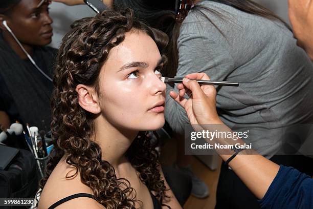 Model prepares backstage at the Rachel Comey fashion show during New York Fashion Week September 2016 on September 7, 2016 in New York City.