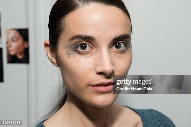 Model prepares backstage at the Rachel Comey fashion show during New York Fashion Week September 2016 on September 7, 2016 in New York City.
