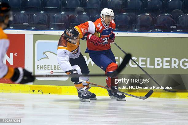 Jerome Leduc of Dynamo Pardubice in clash with Sebastian Furchner of Grizzlys Wolfsburg during the Champions Hockey League match between Dynamo...