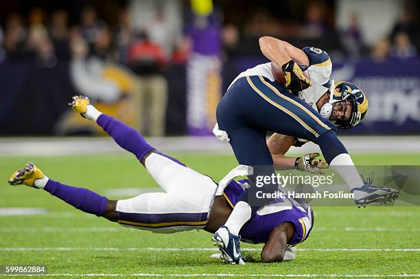 Chase Reynolds of the Los Angeles Rams avoids a tackle by Mackensie Alexander of the Minnesota Vikings during the game on September 1, 2016 at US...