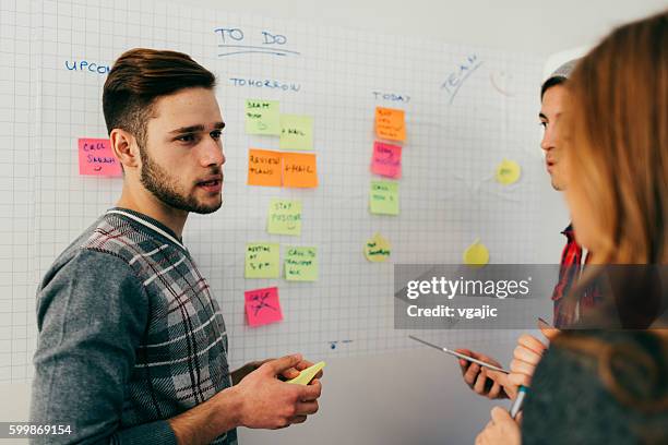 start-up team discussion. - action plan stock pictures, royalty-free photos & images