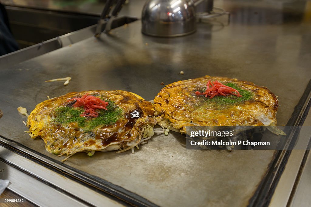Okonomiyaki, Japanese savoury pancakes, Hiroshima, Japan