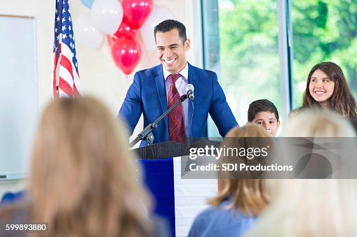 Hispanic politician giving speech, running for local government office