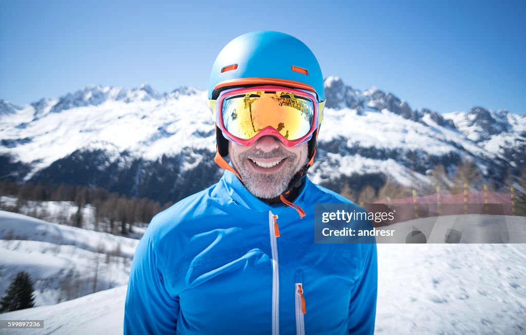 Happy adult man skiing