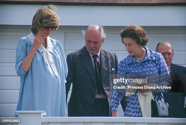 Diana, Princess of Wales with Queen Elizabeth II during a polo match at the Guards Polo Club, Windsor, UK, 30th May 1982. Diana is heavily pregnant...