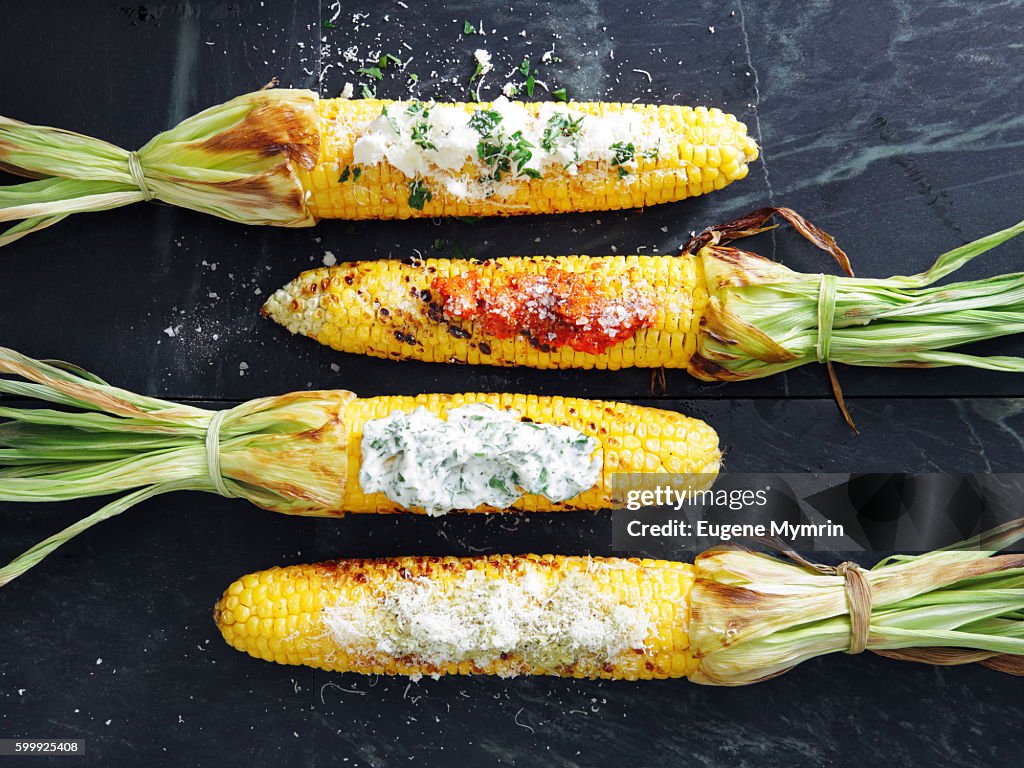 Grilled corn with toppings