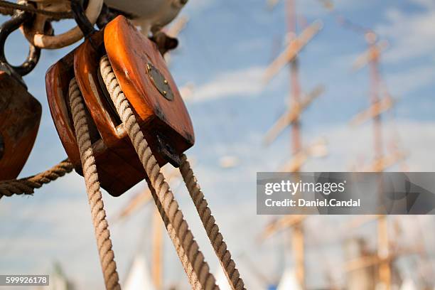 tall ship detail of block during tall ships races 2012 in a coruña, galicia (spain) - timber deck stock-fotos und bilder