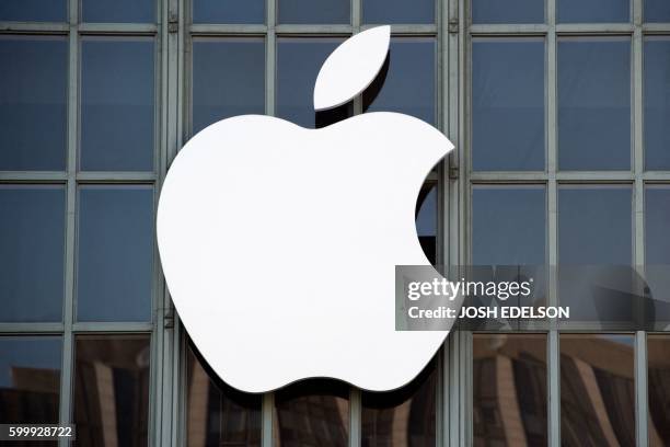 The Apple logo is seen on the outside of Bill Graham Civic Auditorium before the start of an event in San Francisco, California on September 7, 2016....