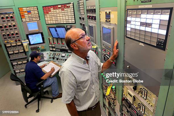 Professor David Moncton, the director of MIT's Nuclear Research Laboratory, looks a a display in the control room, Aug. 17, 2016. This facility is...