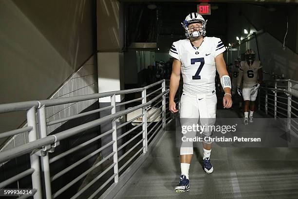 Quarterback Taysom Hill of the Brigham Young Cougars walks out onto the field before the college football game against the Arizona Wildcats at...