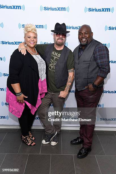 Gospel singer Tamela Mann, Dave Stewart of the band Eurythmics and David Mann visit SiriusXM Studio on September 7, 2016 in New York City.