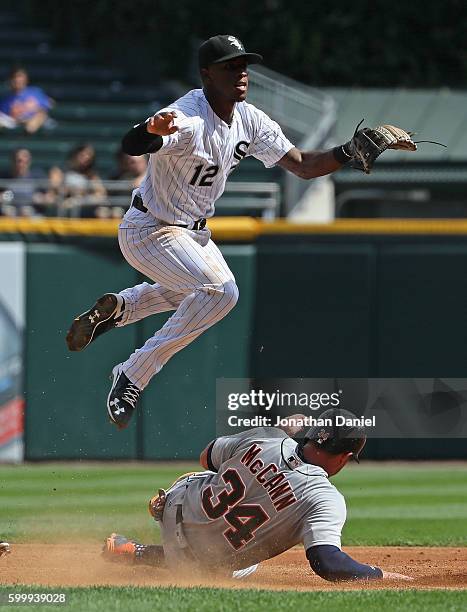 Tim Anderson of the Chicago White Sox leaps over James McCann of the Detroit Tigers as he turns a double play in the 2nd inning at U.S. Cellular...