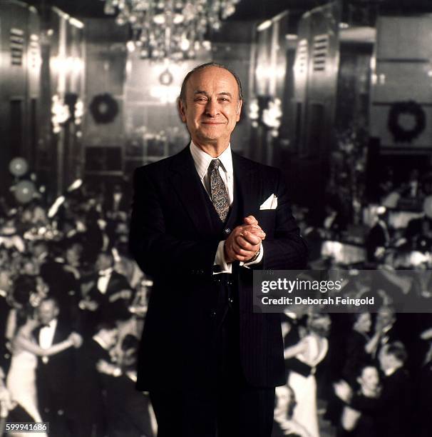 Deborah Feingold/Corbis via Getty Images) NEW YORK Restaurateur Joe Baum standing in front of original Rainbow Room image in March 1986 in New York,...