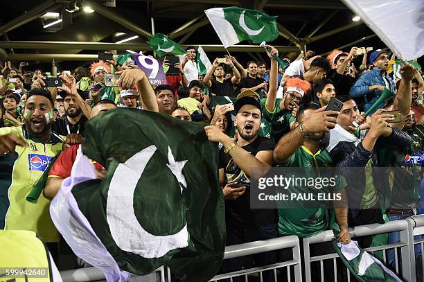 Pakistan cricket fanss celebrate after their team won the T20 international cricket match between England and Pakistan at The Emirates Old Trafford,...