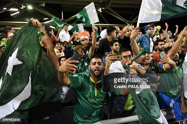Pakistan cricket fanss celebrate after their team won the T20 international cricket match between England and Pakistan at The Emirates Old Trafford,...