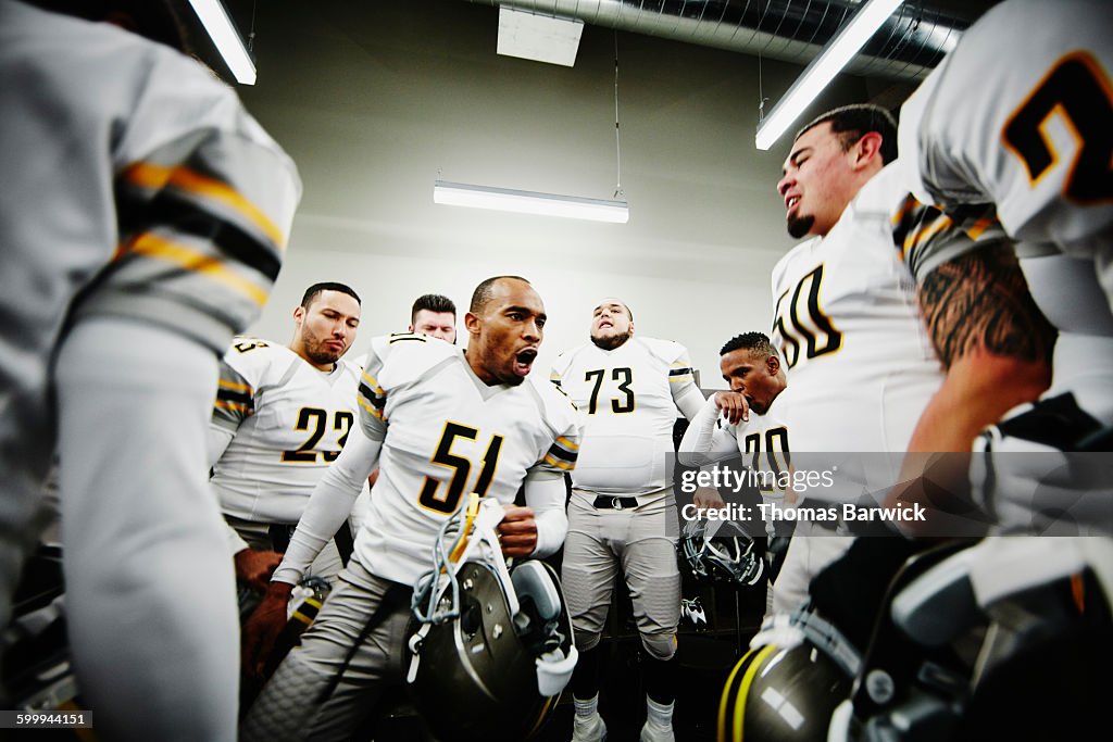 Football player leading team motivational chant