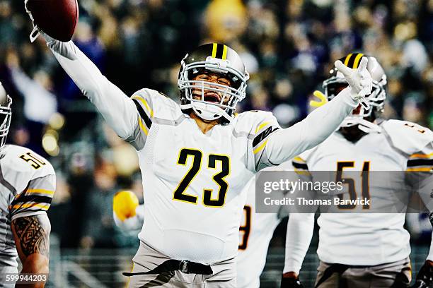 football player celebrating with teammates - american football game bildbanksfoton och bilder