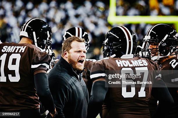 football coach yelling at players during timeout - american football professional player not soccer stock pictures, royalty-free photos & images