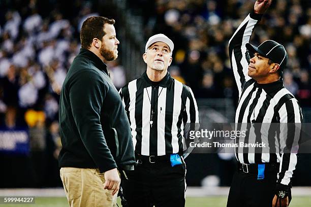 football referee throwing flag on coach - oficial deportivo fotografías e imágenes de stock