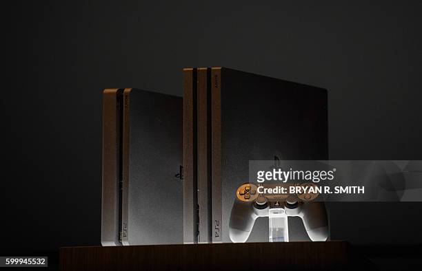 The new Sony Playstation 4 and Playstation 4 Pro are unveiled at the Playstation Theater on September 7, 2016 in New York. / AFP / Bryan R. Smith