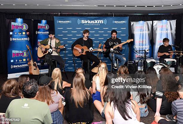 Musicians Michael Clifford, Luke Hemmings, Calum Hood, and Ashton Irwin of 5 Seconds of Summer perform at the 5 Seconds of Summer Soundcheck Party on...