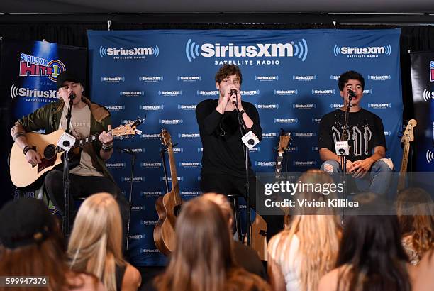 Musicians Michael Clifford, Luke Hemmings, and Calum Hood of 5 Seconds of Summer perform at the 5 Seconds of Summer Soundcheck Party on SiriusXM Hits...