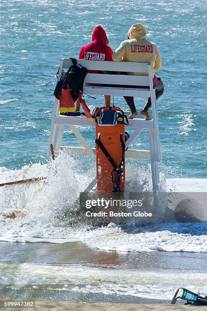 Lifeguards at Nantucket's Surfside Beach watch as the tide overtakes their lifeguard stand on Nantucket as Hermine creeps up the coast, Sept. 4,...