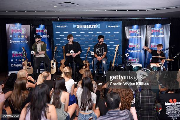 Musicians Michael Clifford, Luke Hemmings, Calum Hood, and Ashton Irwin of 5 Seconds of Summer perform at the 5 Seconds of Summer Soundcheck Party on...