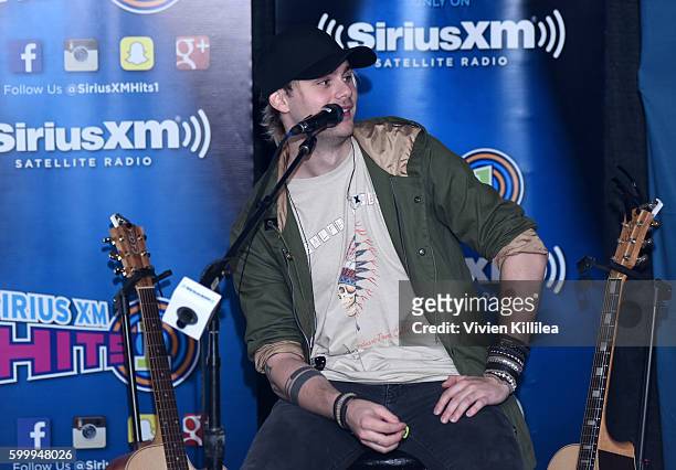 Musician Michael Clifford of 5 Seconds of Summer performs at the 5 Seconds of Summer Soundcheck Party on SiriusXM Hits 1 at The Forum on September 7,...
