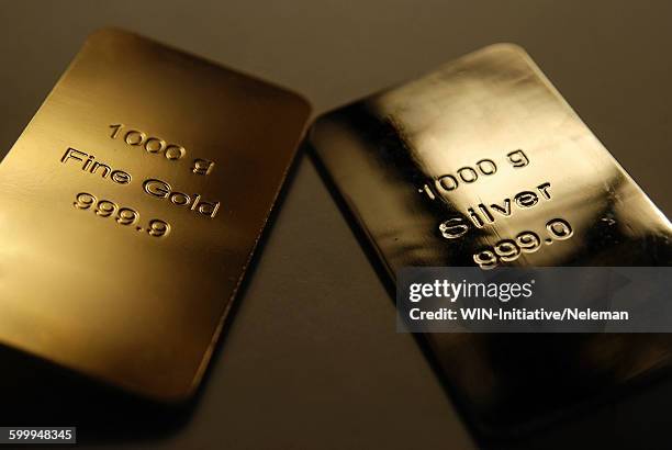 bars of gold and silver - gold bars stock-fotos und bilder