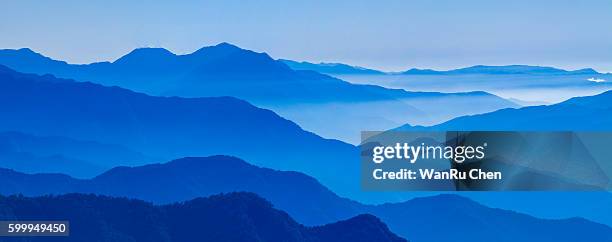 view of blue mountains in the fog. central mountains taiwan - blue fog stock pictures, royalty-free photos & images