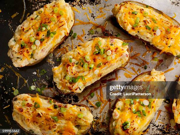 twice baked, stuffed potatoes with cheese and bacon - stuffed potato stock pictures, royalty-free photos & images