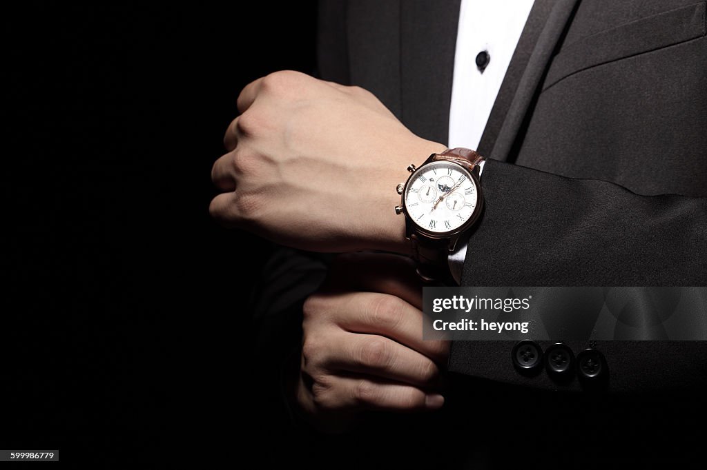 With a wrist watch