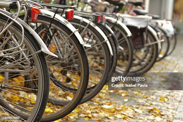 cropped image of bicycles in parking lot - bruselas bildbanksfoton och bilder