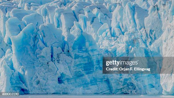 The Knik Glacier in Alaska. Lack of snow-cover expose the ash fallout from the nearby Redoubt Volcano, reducing the albedo effect. There are...