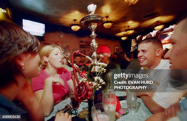 Smoking with friends at Hookah Lounges is a hot trend that continues the age-old tradition that began in India a thousand years ago.