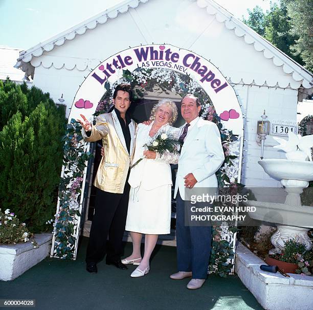Couple marries with an Elvis Presley impersonator in Las Vegas' Little White Chapel.