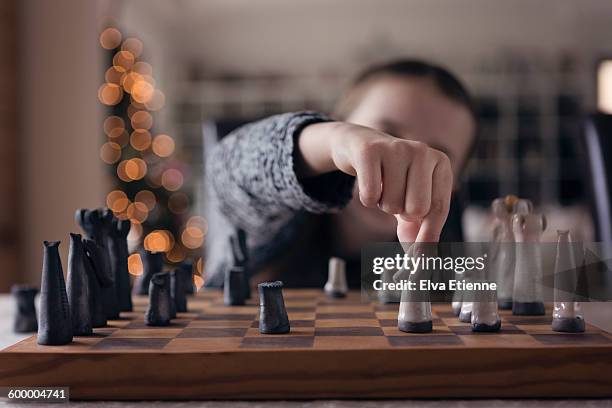 child playing chess - kids playing chess stock pictures, royalty-free photos & images