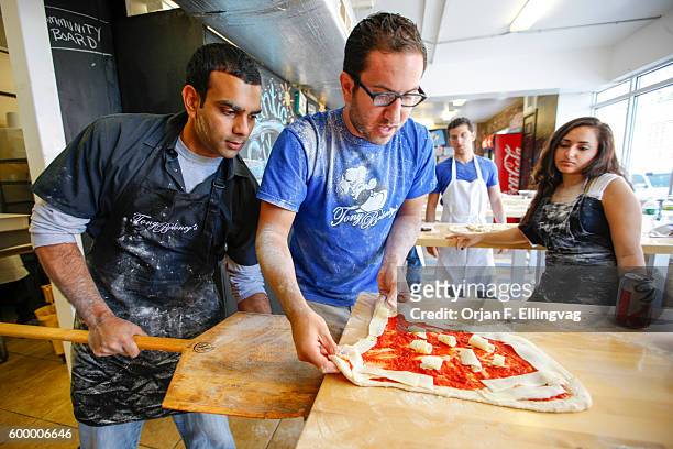 Owner of Tony Boloney's Pizza, Michael Hauke, teaches how to make proper pizza at his restaurant in Atlantic City. Michael Hauke opened the first...